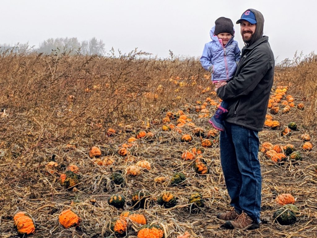 our family visiting the pumpkin patch, just one of the activities on the fall bucket list printable