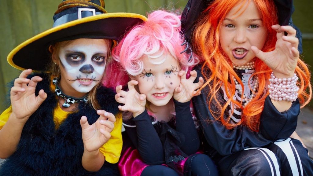 children dressed up in halloween costumes