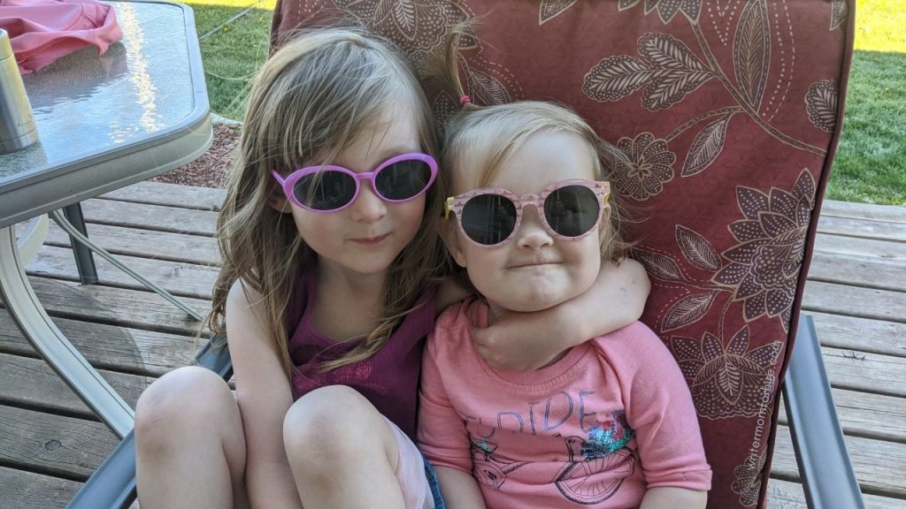 young girls wearing their sunglasses