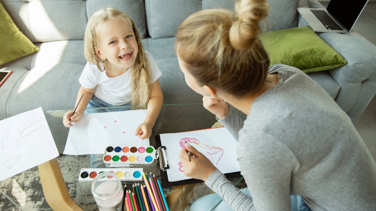 mom and daughter painting together